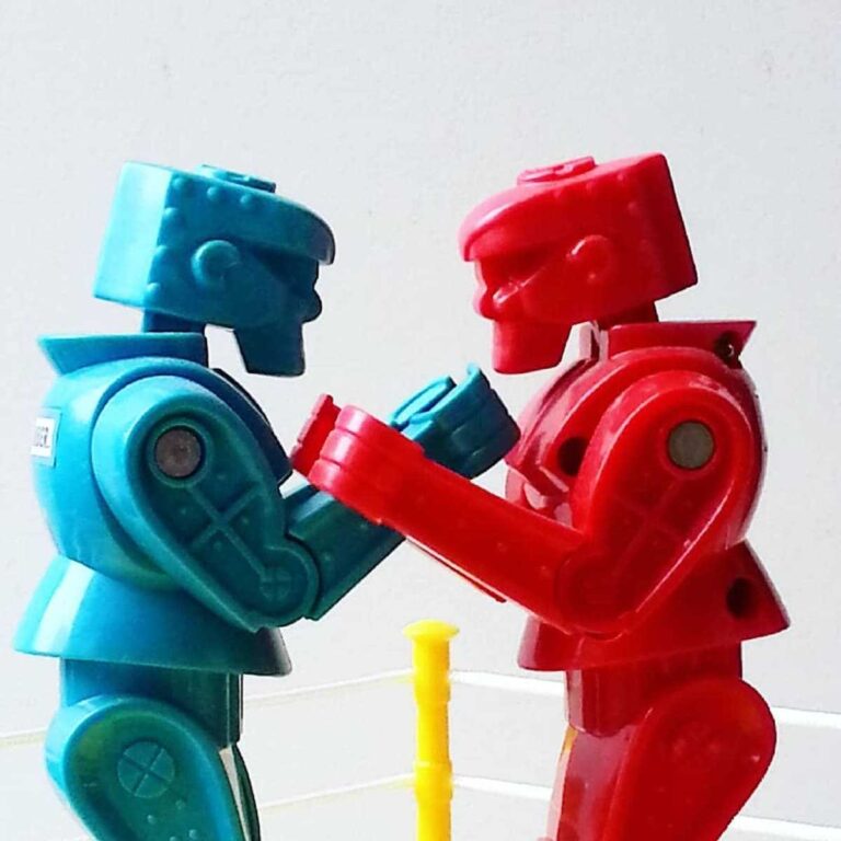 side view of red and blue toy boxing figures again 2025 01 08 06 13 21 utc 1